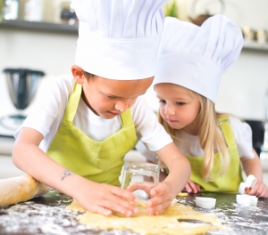 young kids happy childrens family preparing funny cookies in kitchen at home
